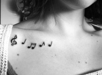 chest-tattoos-music-notes-women