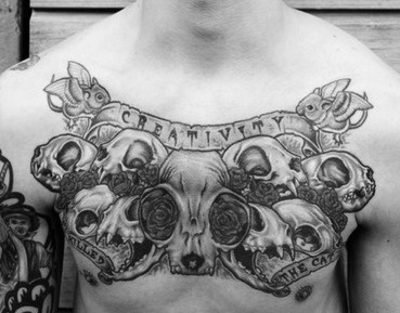 chest-tattoos-skull-scroll