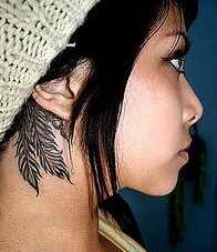 ear-tattoo-behind-feathers