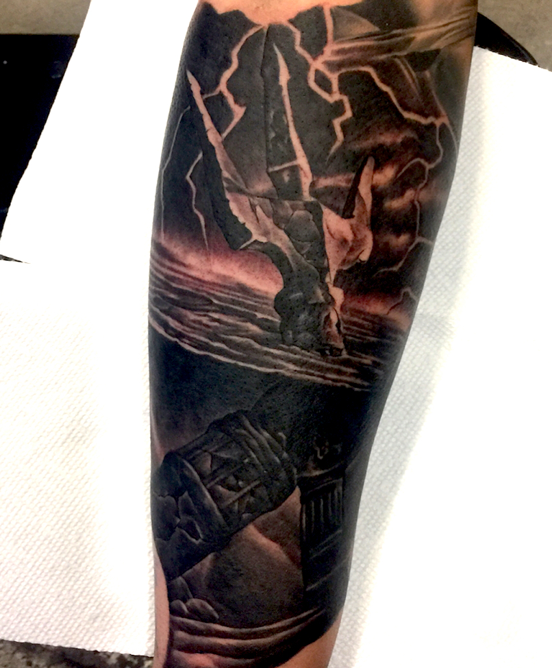 Poseidon tattoo on forearm by Chris Beardsley
