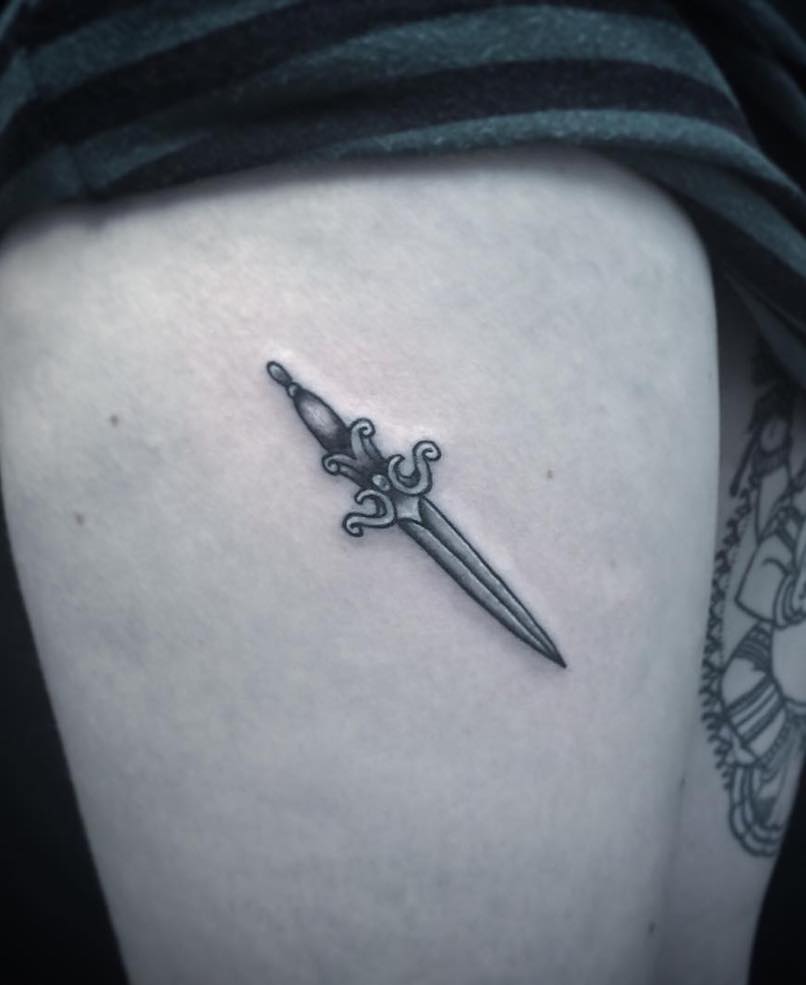 Small dagger tattoo by Alexander Pilerci
