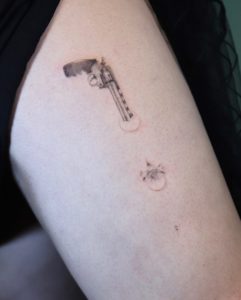 Gun Small Tattoo by Como Tattoo