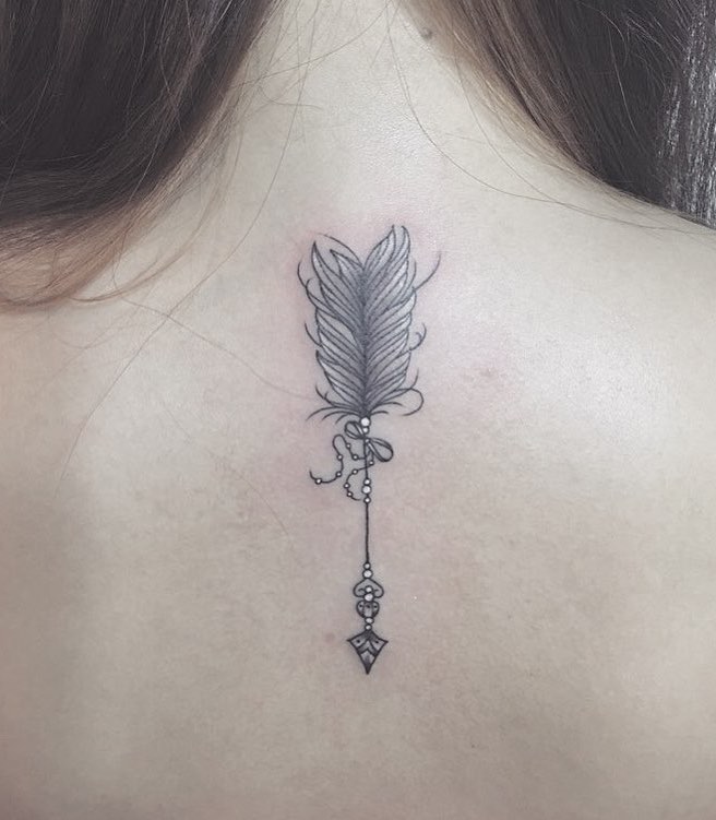 Arrow and Feather Tattoo by JG Tattoo