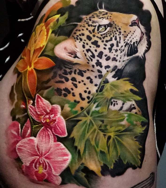 Flowers and Jaguar Tattoo by Khan Tattoo