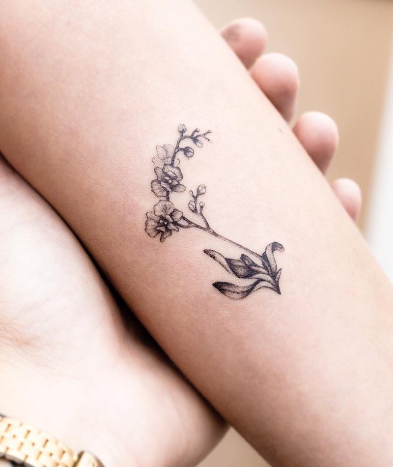 Tattoo tagged with: flower, small, orchid, black, tiny, hand poked, little,  nature, wrist, laramaju | inked-app.com