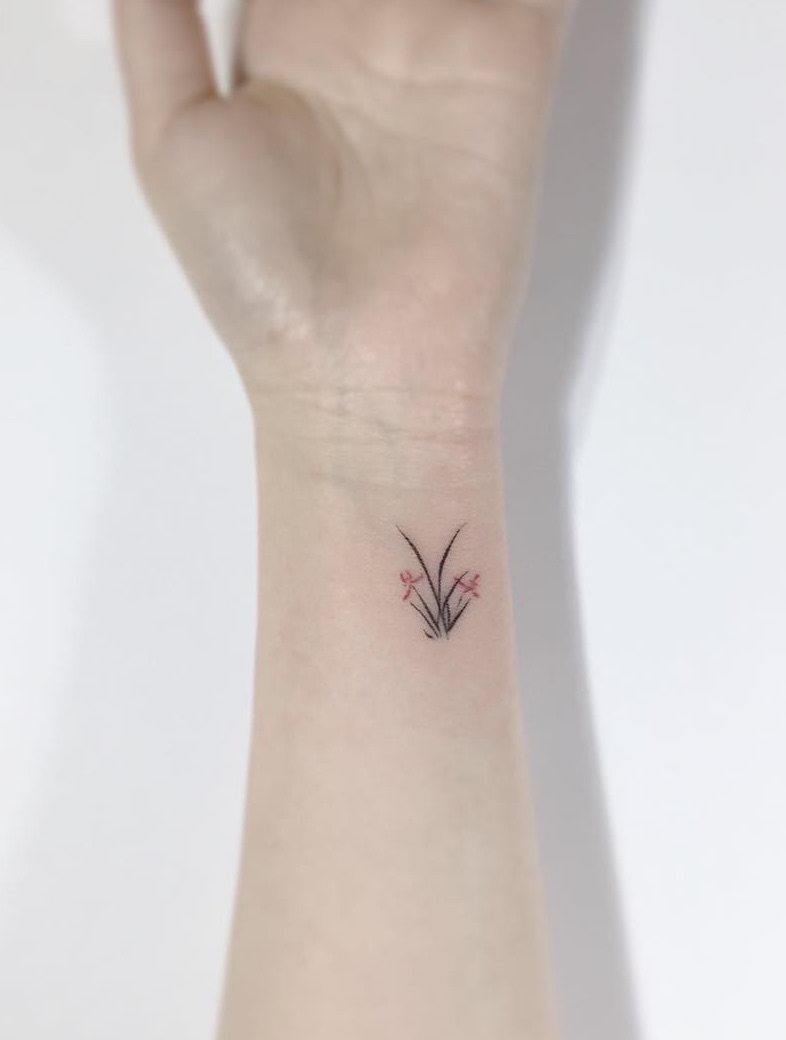 Orchid Tattoo by Playground Tattoo - Tattoo Insider