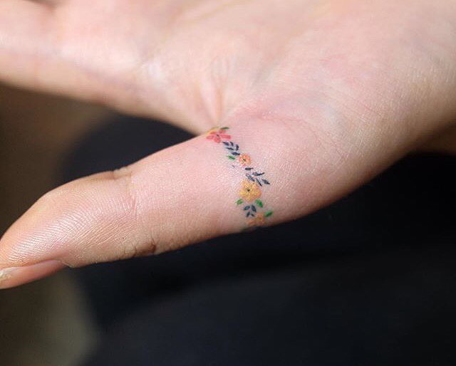 Small Finger Tattoo by Zihee