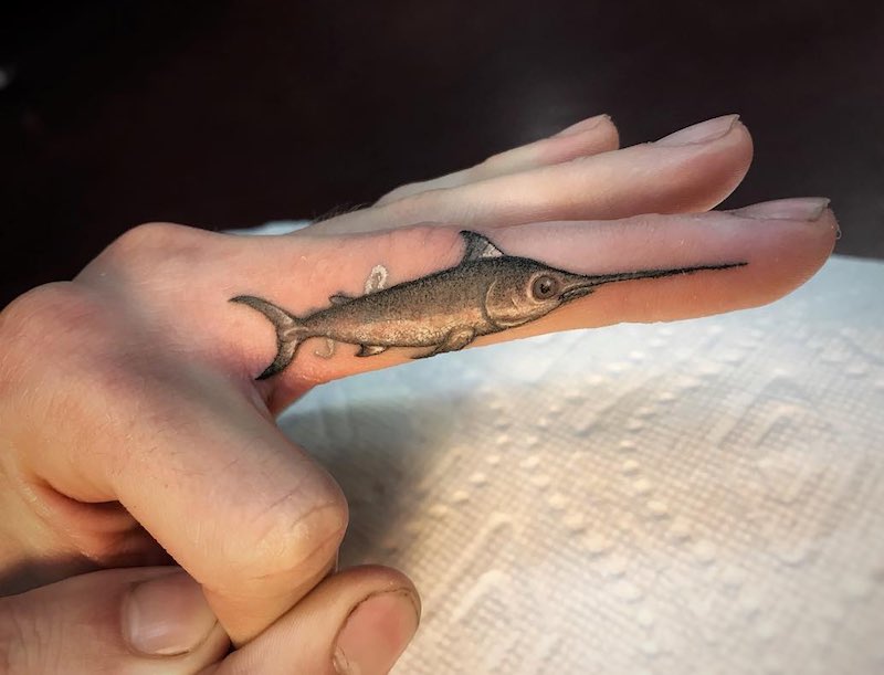 Small Fish Finger Tattoo by Ben Grillo