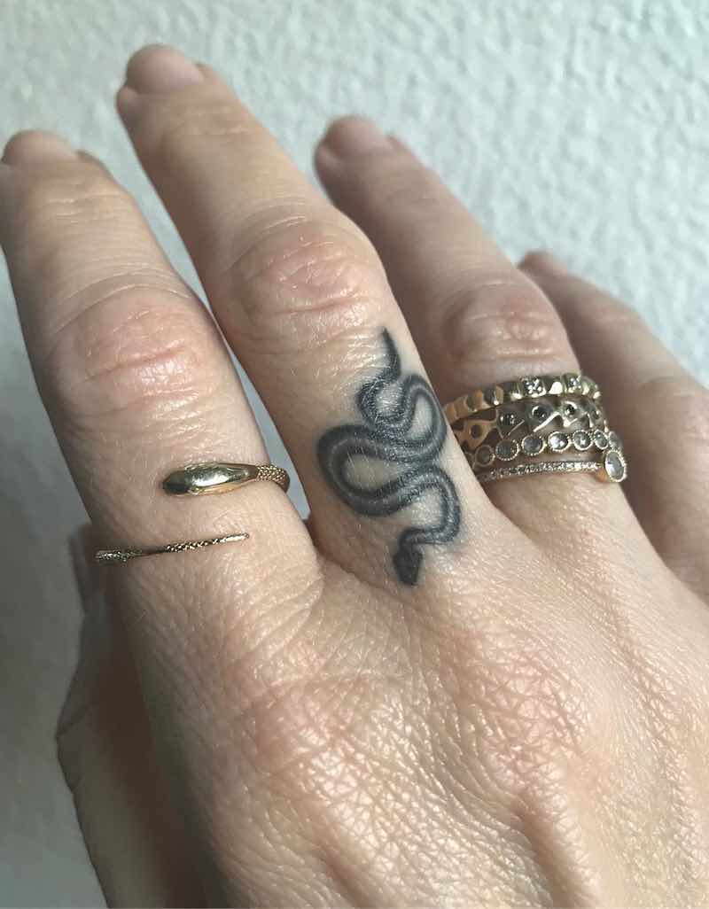 Small Snake Middle Finger Tattoo by Ben Grillo
