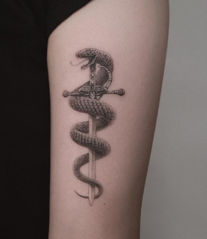 What does Snake Around Dagger Tattoo Mean